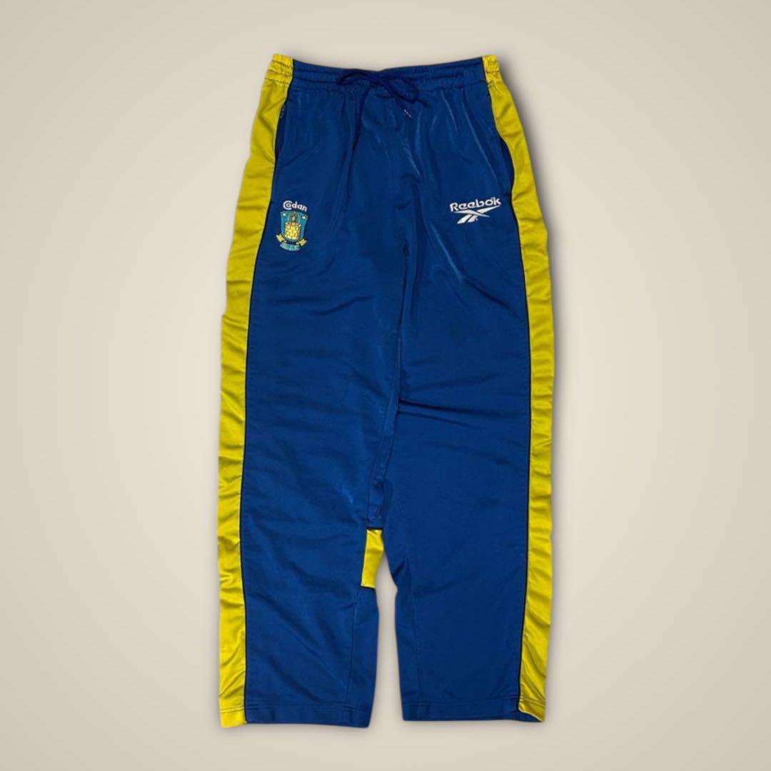 リーボック ReebokトラックパンツサイドスナップサッカーブレンビーIF青黄