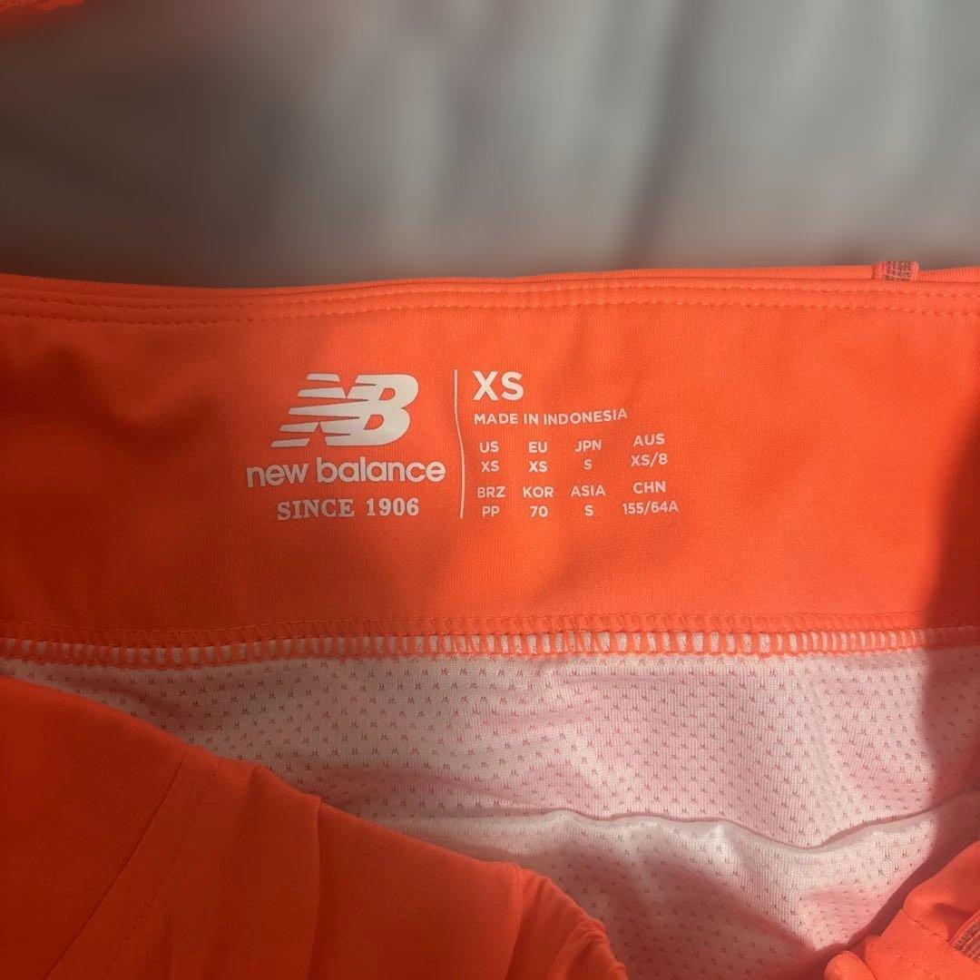 New Balance オレンジ スポーツウェア XS