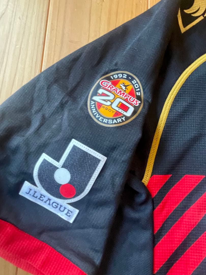 サッカーＪリーグ　名古屋グランパス 20周年記念ユニホーム　12サイズOサイズ