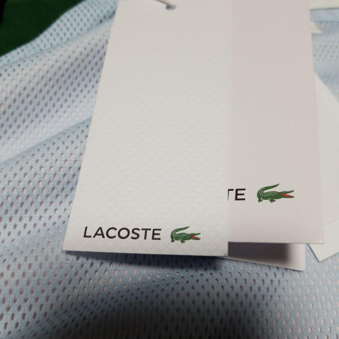 新品未使用。正規LACOSTEスポーツウインドブレーカー「フード付き」
