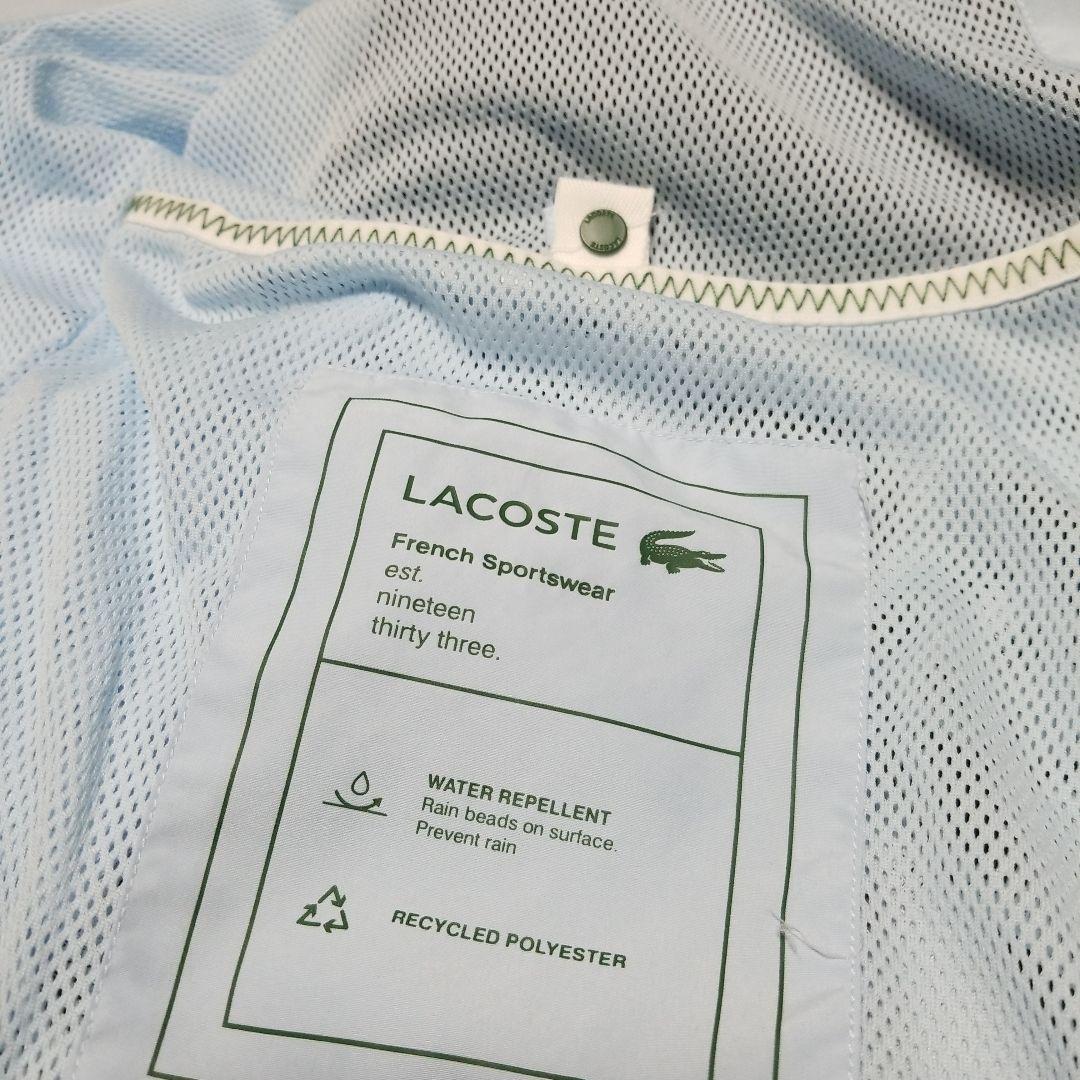 新品未使用。正規LACOSTEスポーツウインドブレーカー「フード付き」