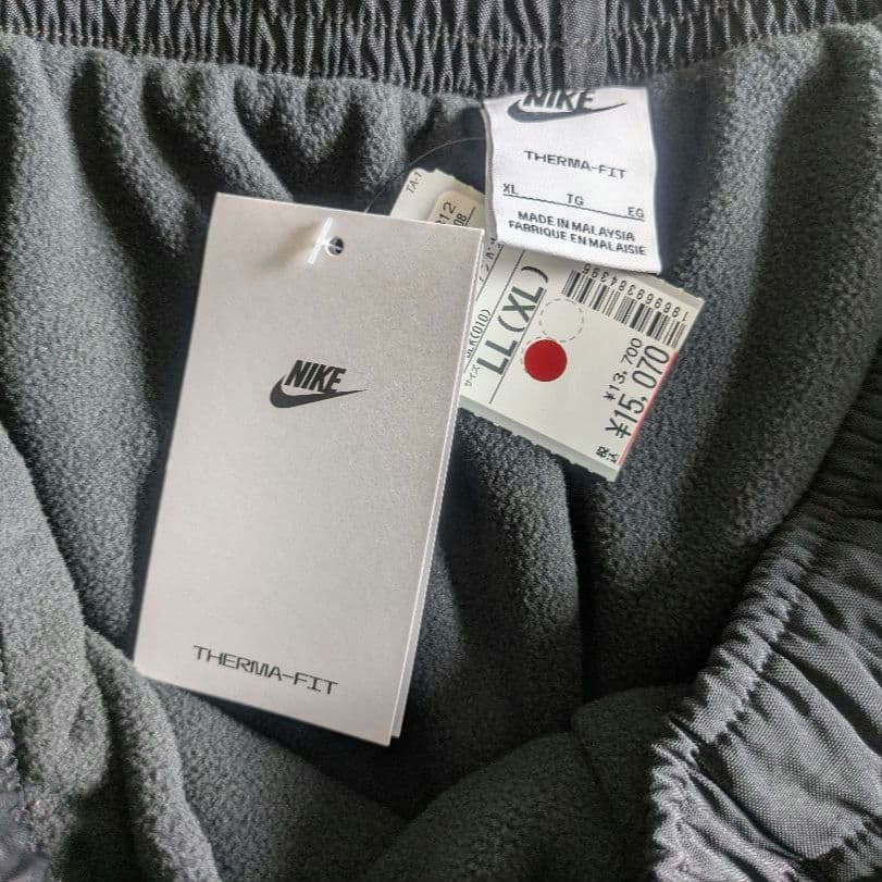 新品 NIKE ナイキ ナイロンウーブンパンツ 裏起毛