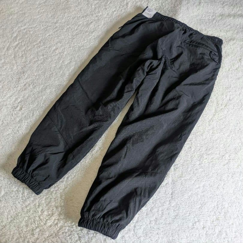 新品 NIKE ナイキ ナイロンウーブンパンツ 裏起毛