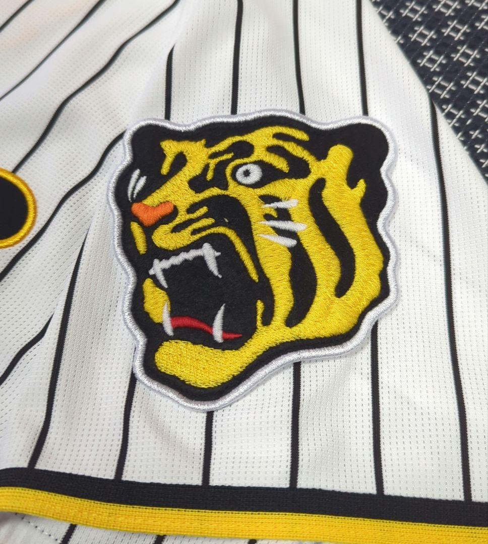 阪神タイガース　チャンピオン　エンブレム付き　ユニフォーム　佐藤輝明【Ｌサイズ】