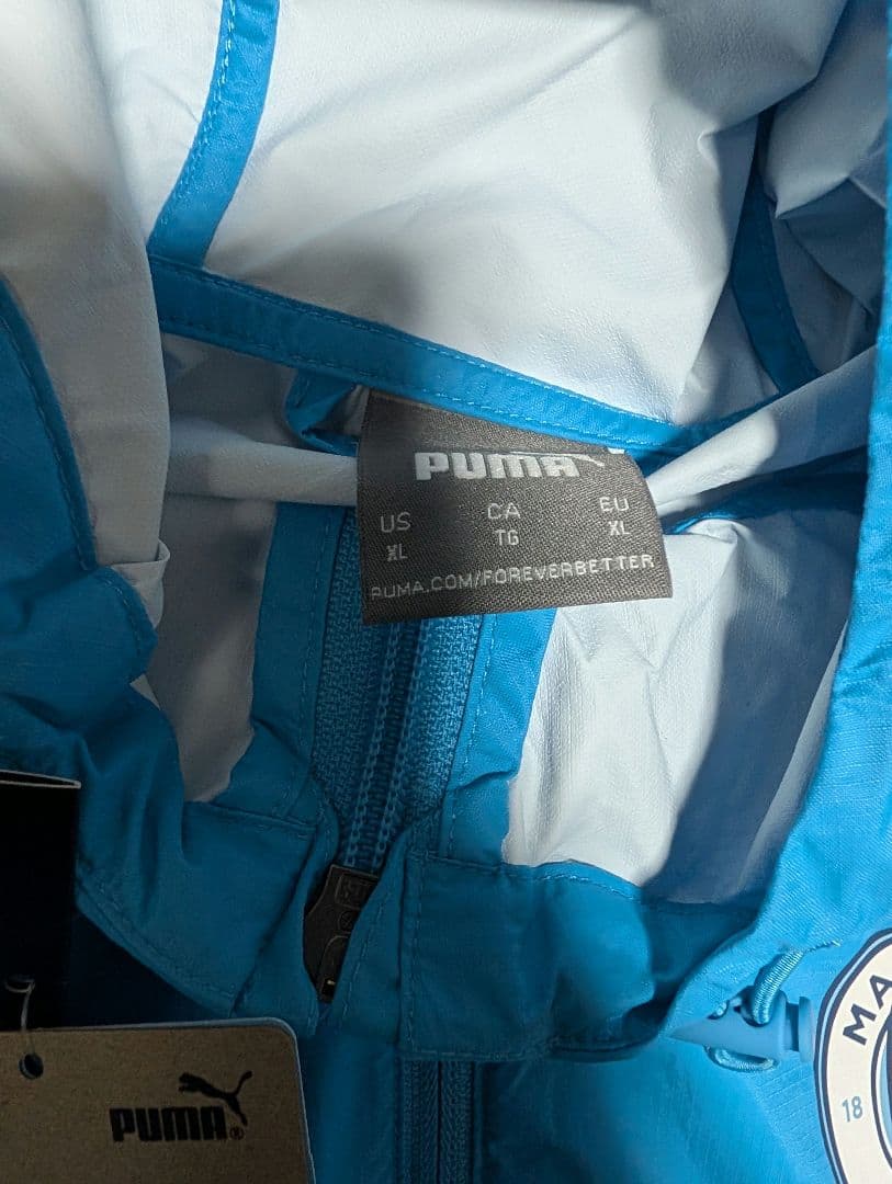 マンチェスターシティ　青色　ウインドブレーカー　XL 新品未使用タグ付きPUMA