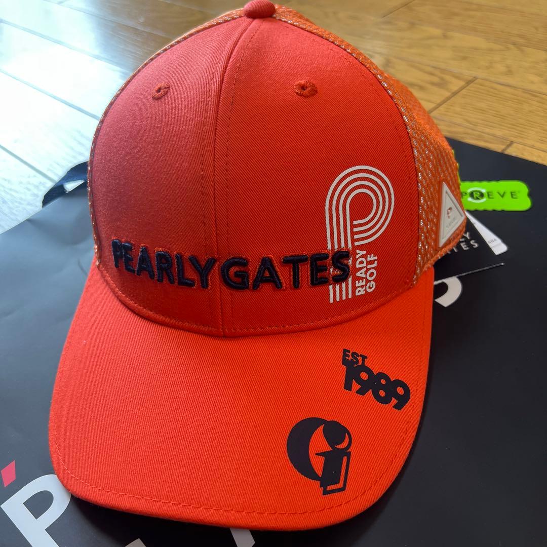 PEARLY GATES オレンジゴルフキャップ　左側面4 つのロゴマークあ入り