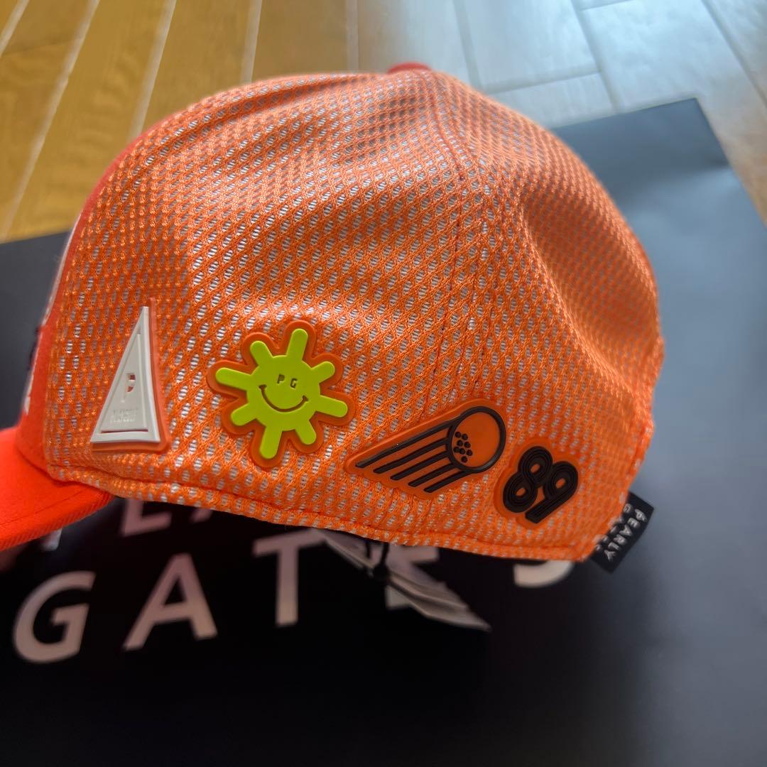 PEARLY GATES オレンジゴルフキャップ　左側面4 つのロゴマークあ入り